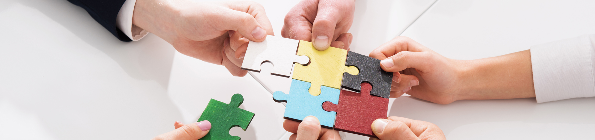 puzzle pieces coming together to represent how ehr mergers work