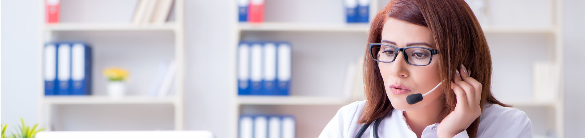 A female physician on a telemedicine visit with a patient