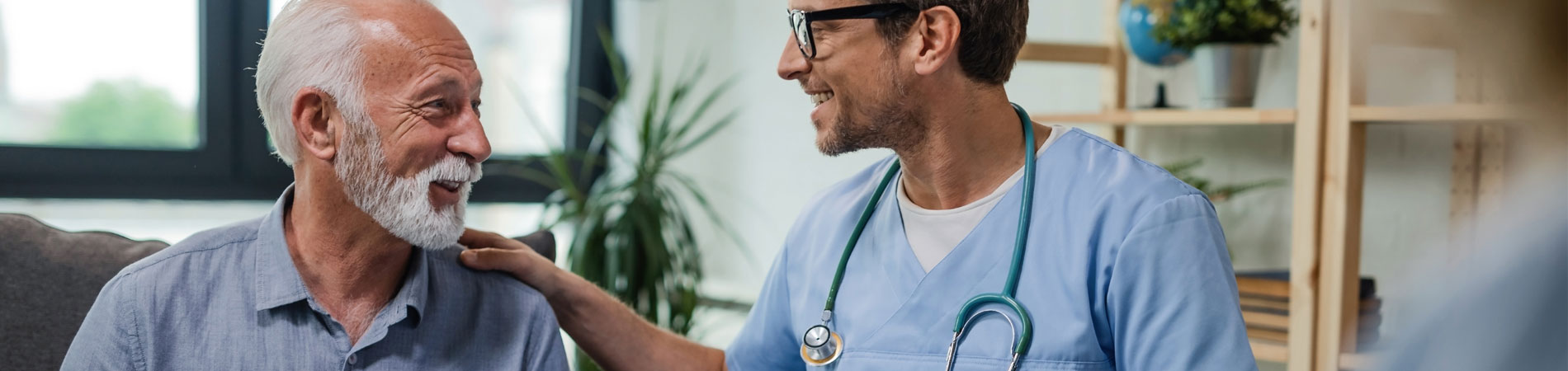 doctor and elderly patient smiling